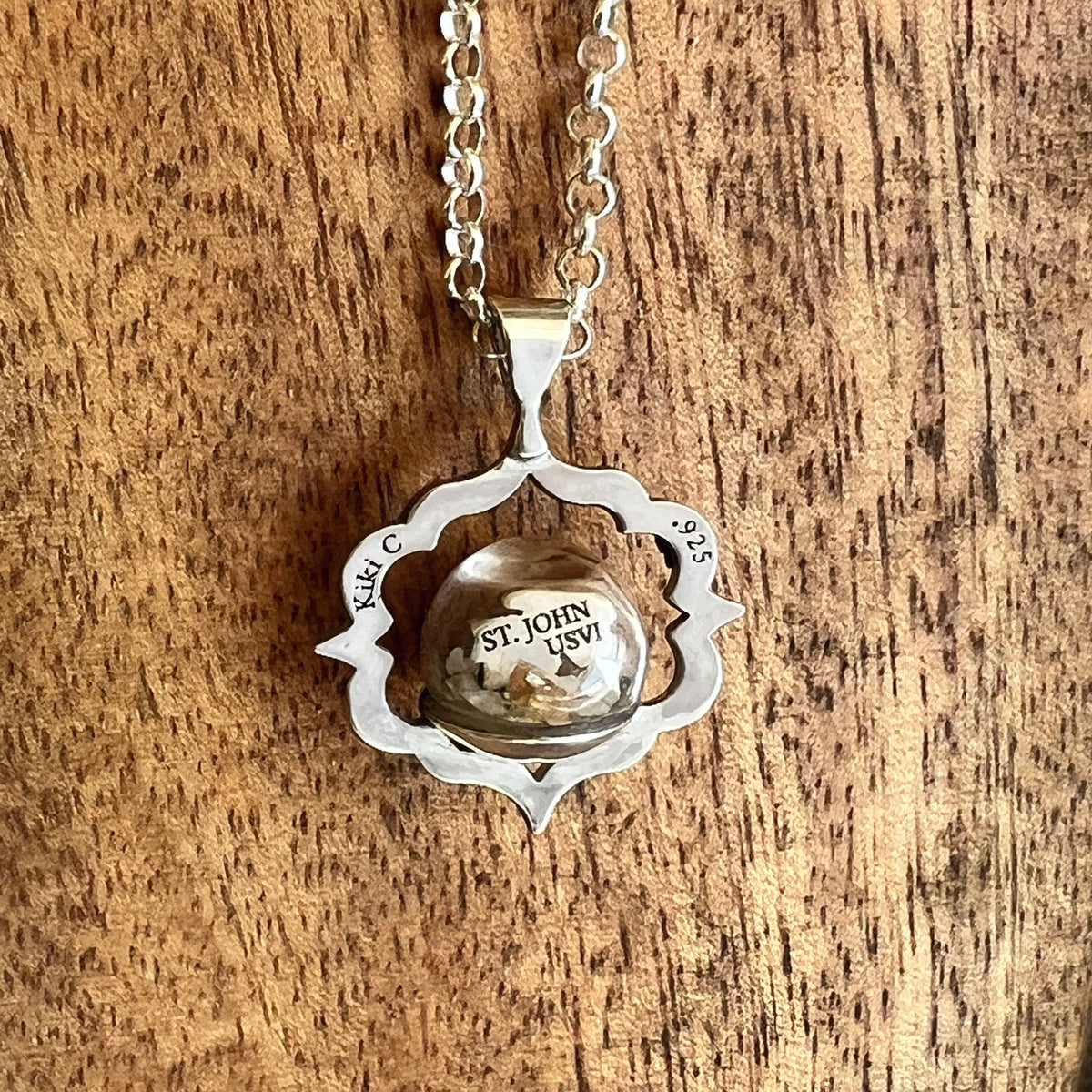 Back detail of Palm Tree Beach Globe necklace