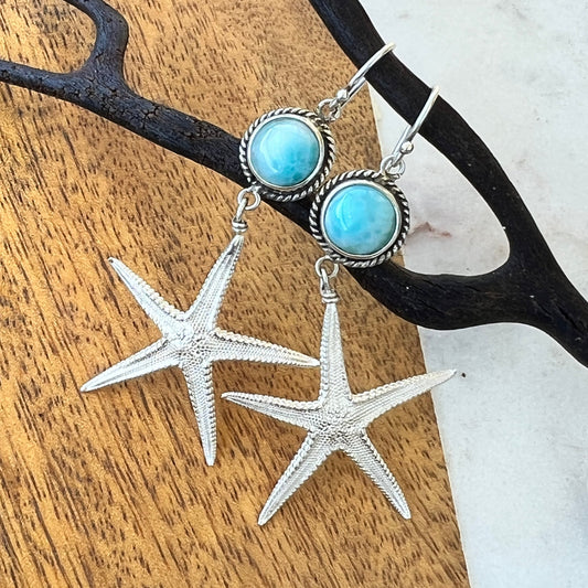Jewelry set with starfish charms on a wooden surface
