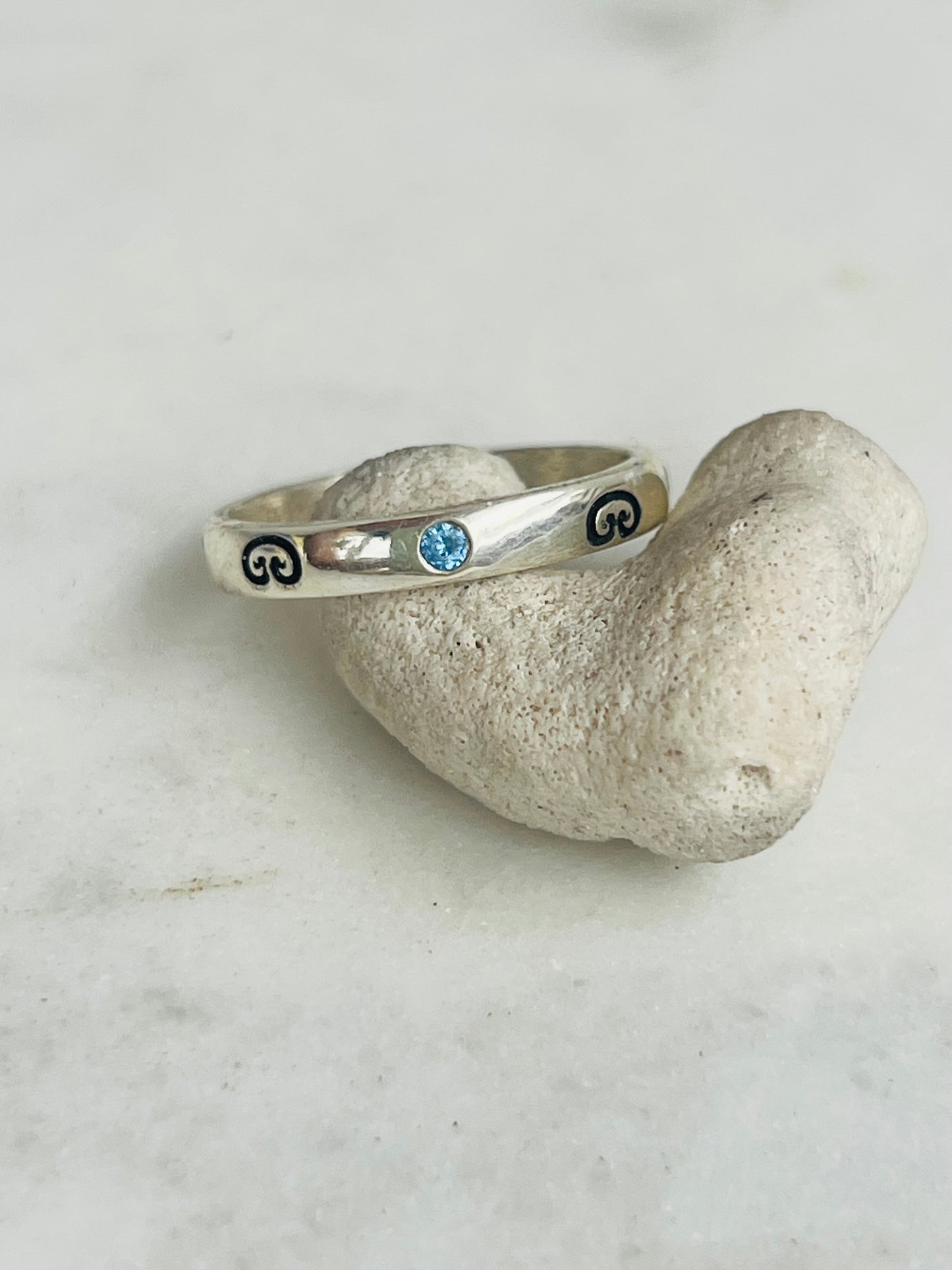 Silver ring with blue gemstone 