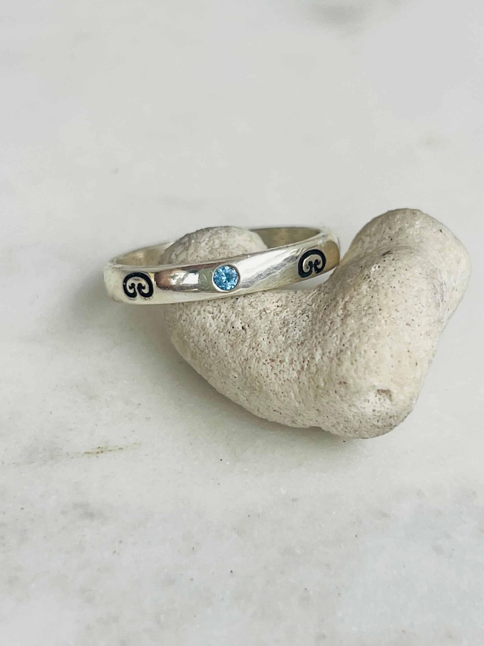 Silver ring with blue gemstone 