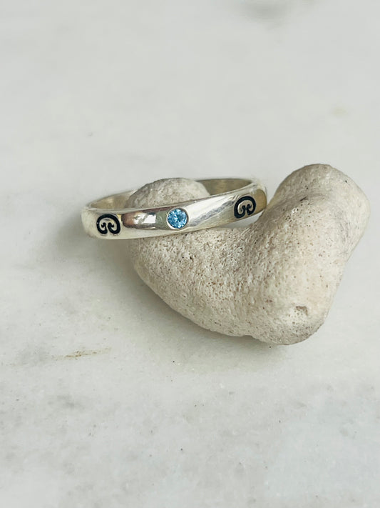 Silver ring with blue gemstone 